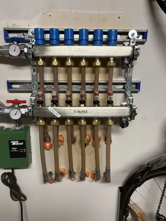 Plumber performing Gas Line Installation at a residential property in Lansing